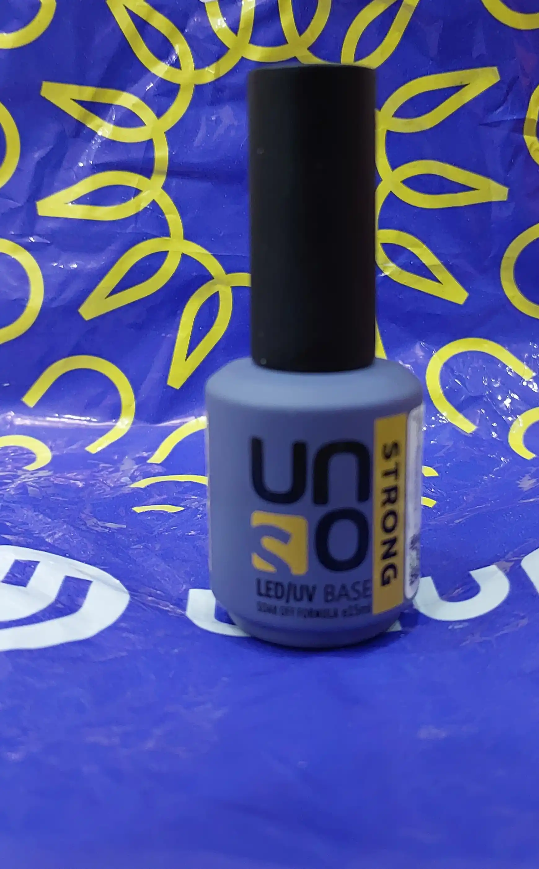 Baza, tirnoq bo'yog'i uchun asos qoplama Uno Strong, 15 ml