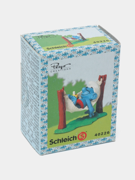 Игрушечная фигурка Schleich Smurf in Hammcock