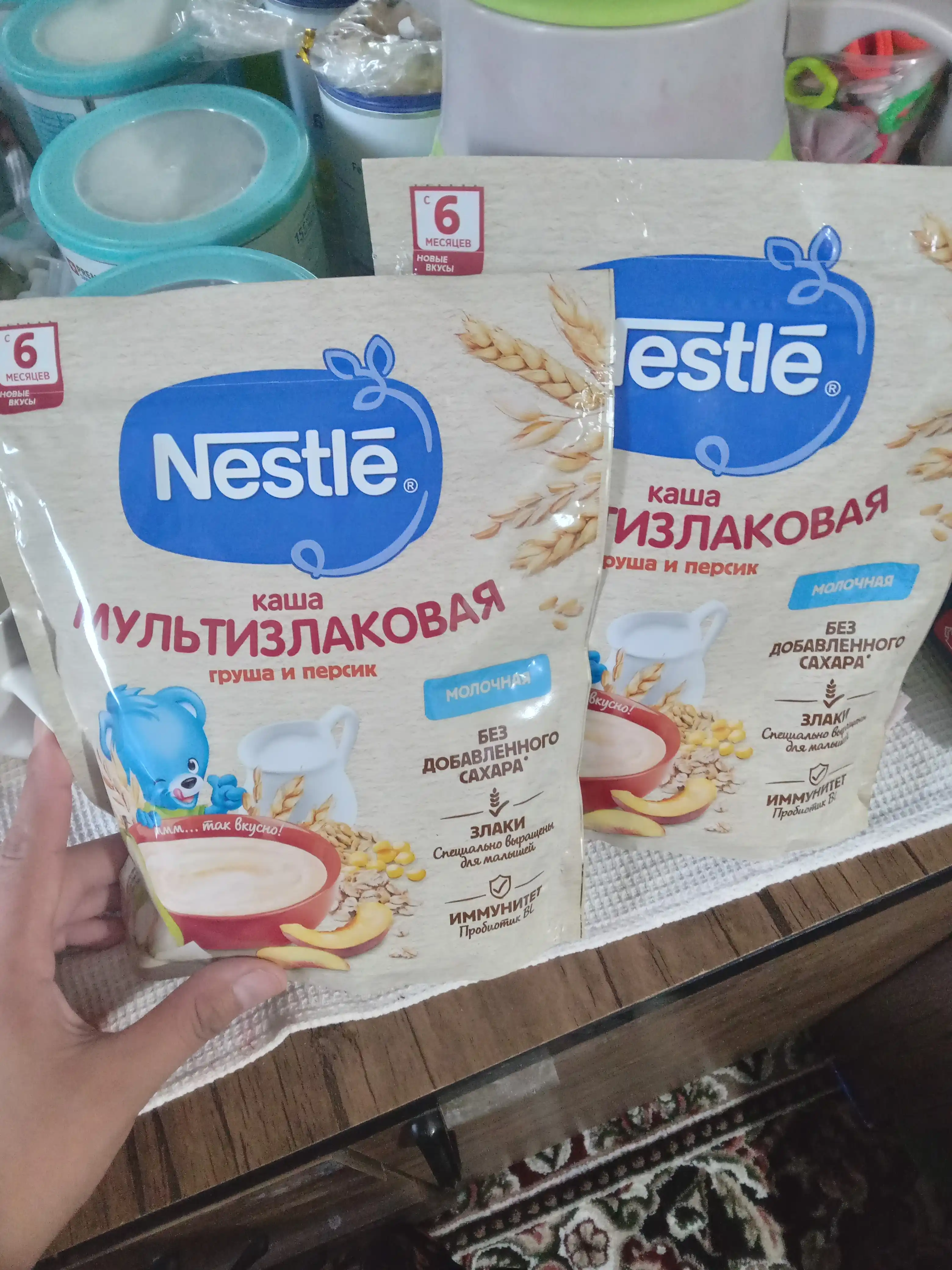 NESTLE® sutli ko‘pzraxli bo‘tqa, nok va shaftoli bilan, 6 oylikdan boshlab, 200 g