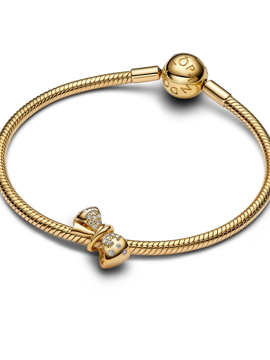 Pandora “Yaltiroq bantik” sharmi, tillarang, shaffof toshlar bilan 763442C01