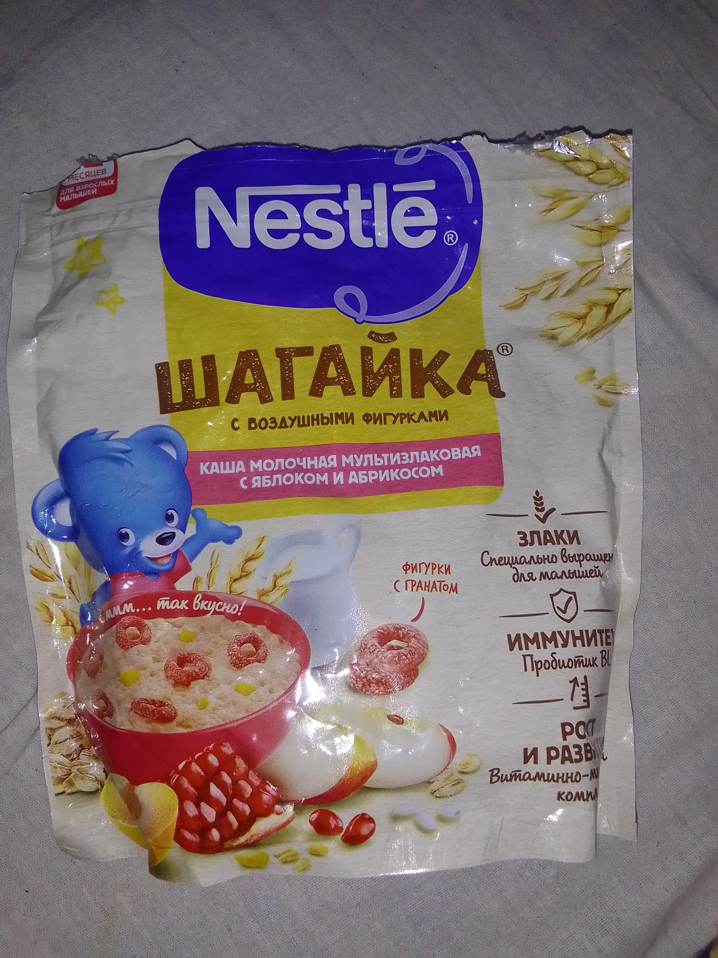 Каша Nestle Шагайка "Мультизлаковая с гранатом, с яблоком и кусочками абрикоса", 190г