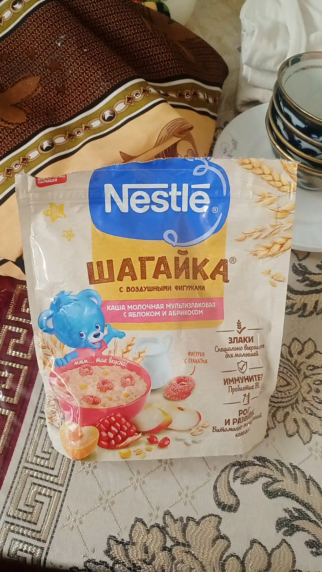 Каша Nestle Шагайка "Мультизлаковая с гранатом, с яблоком и кусочками абрикоса", 190г