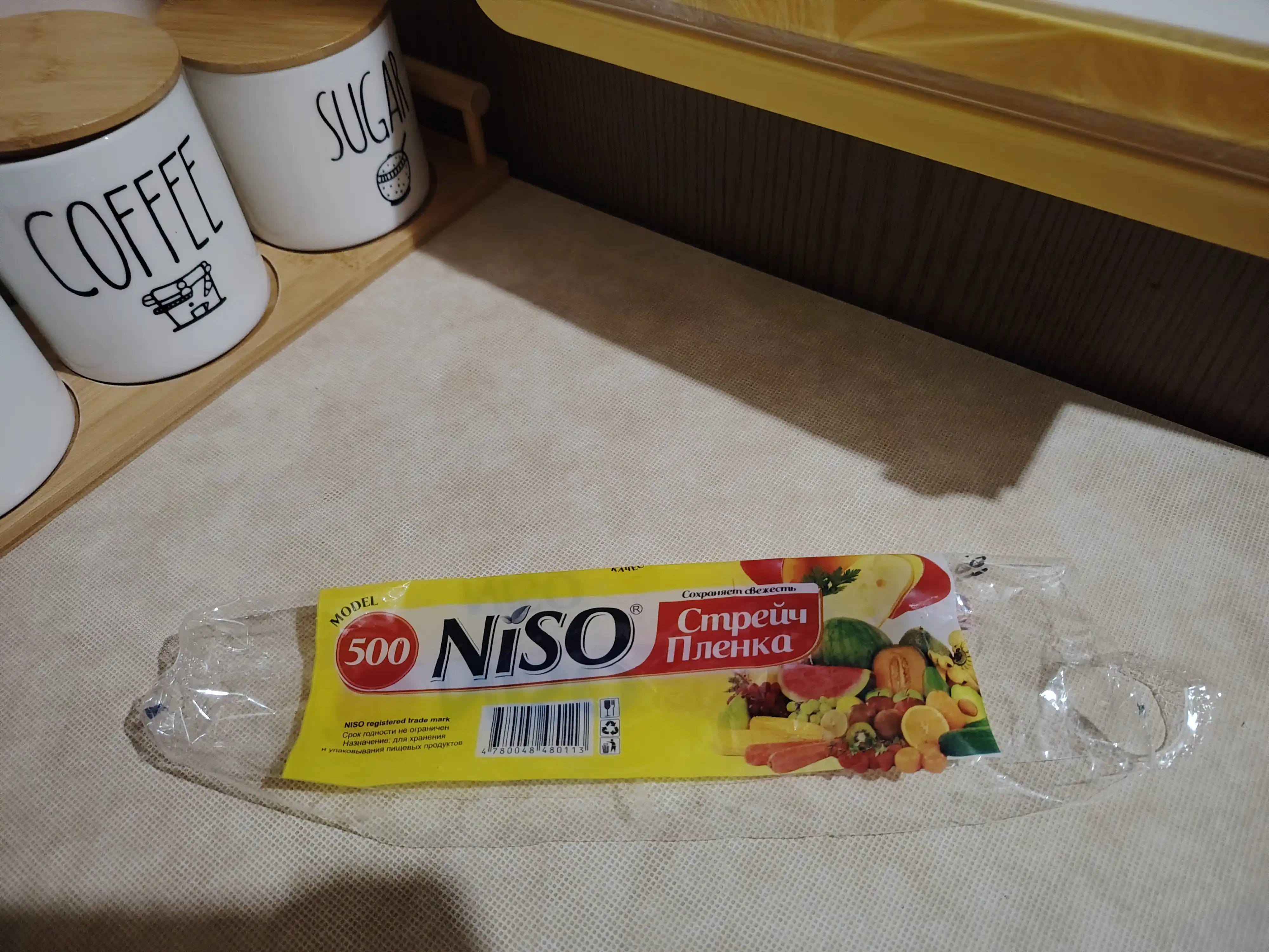 Folga va pergament oziq-ovqat plyonkasi uchun dispenser, kesish bilan