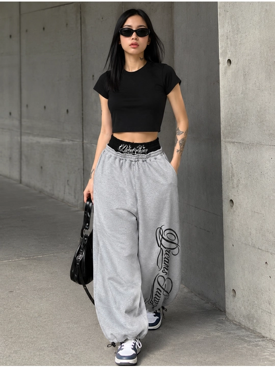 Ayollar joggerlari OVERSIZE paxta bosma bilan Dreams Hustle rezinkada 42–48