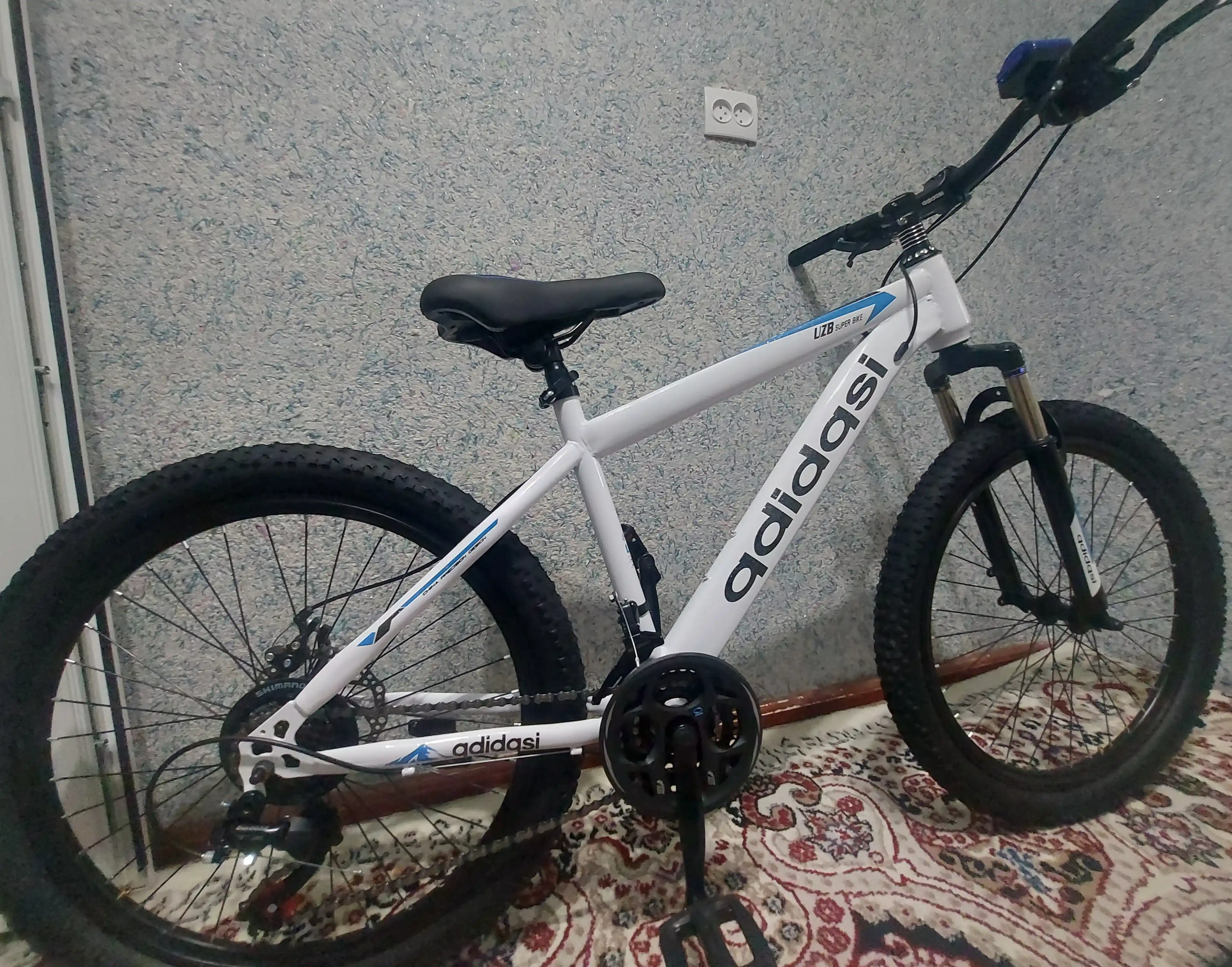 Tog‘ velosipedi, 24 dyuym, 21 tezlik, ikki diskli tormoz, old amortizator, po‘lat rama