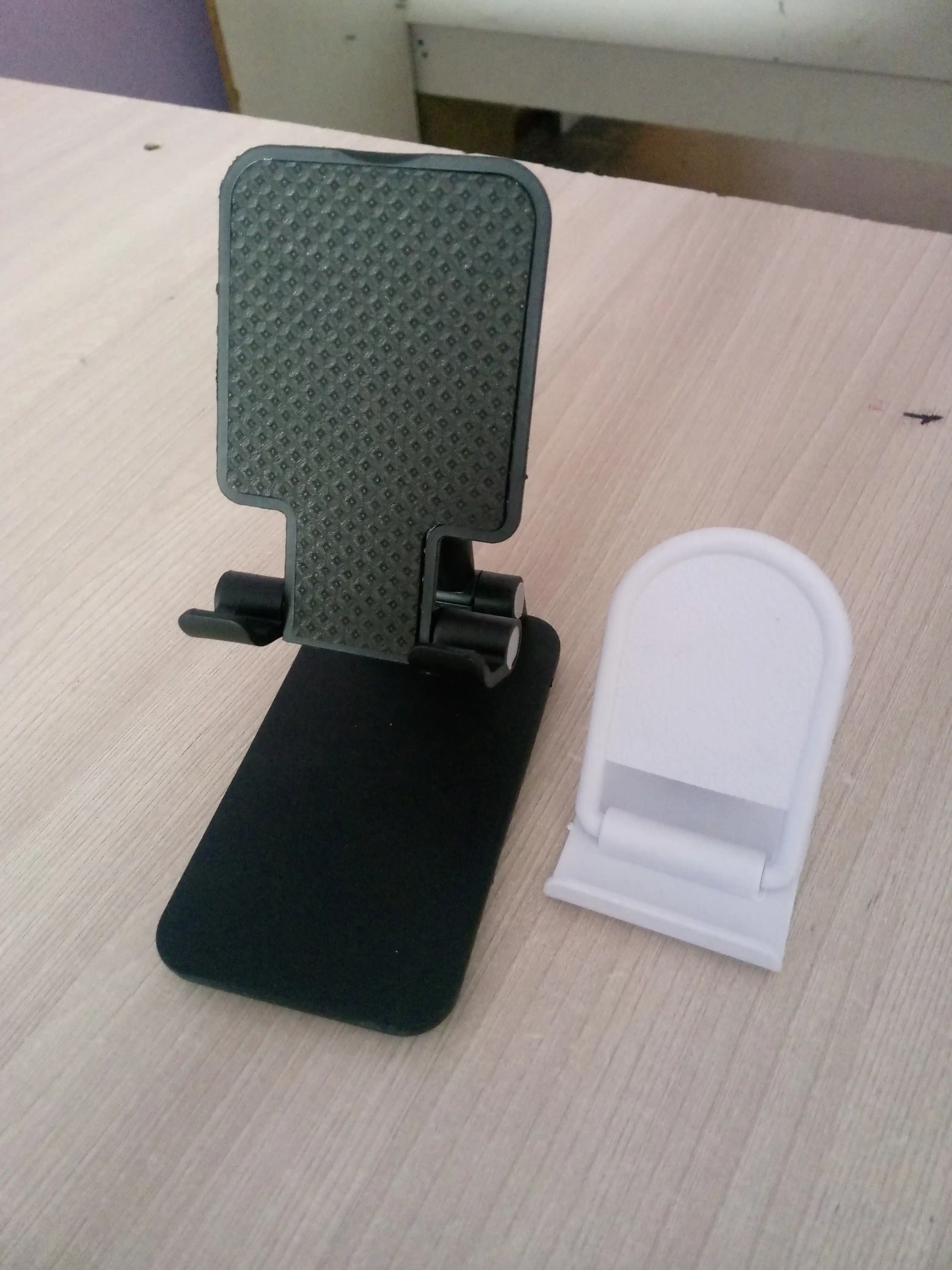 Telefon va planshet uchun sozlanadigan, buklanadigan taglik-ushlagich