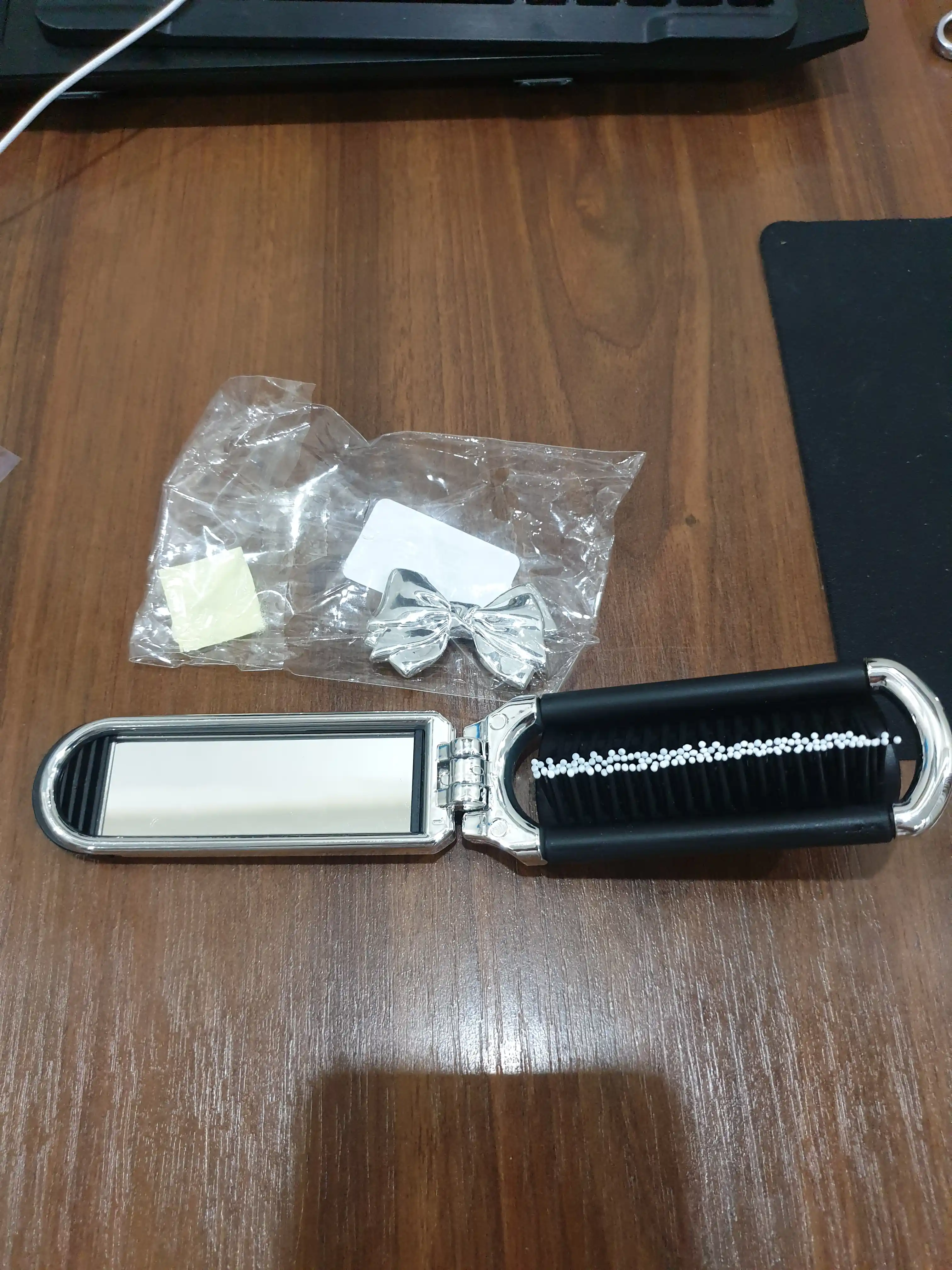 Oynali buklanadigan mini taroq