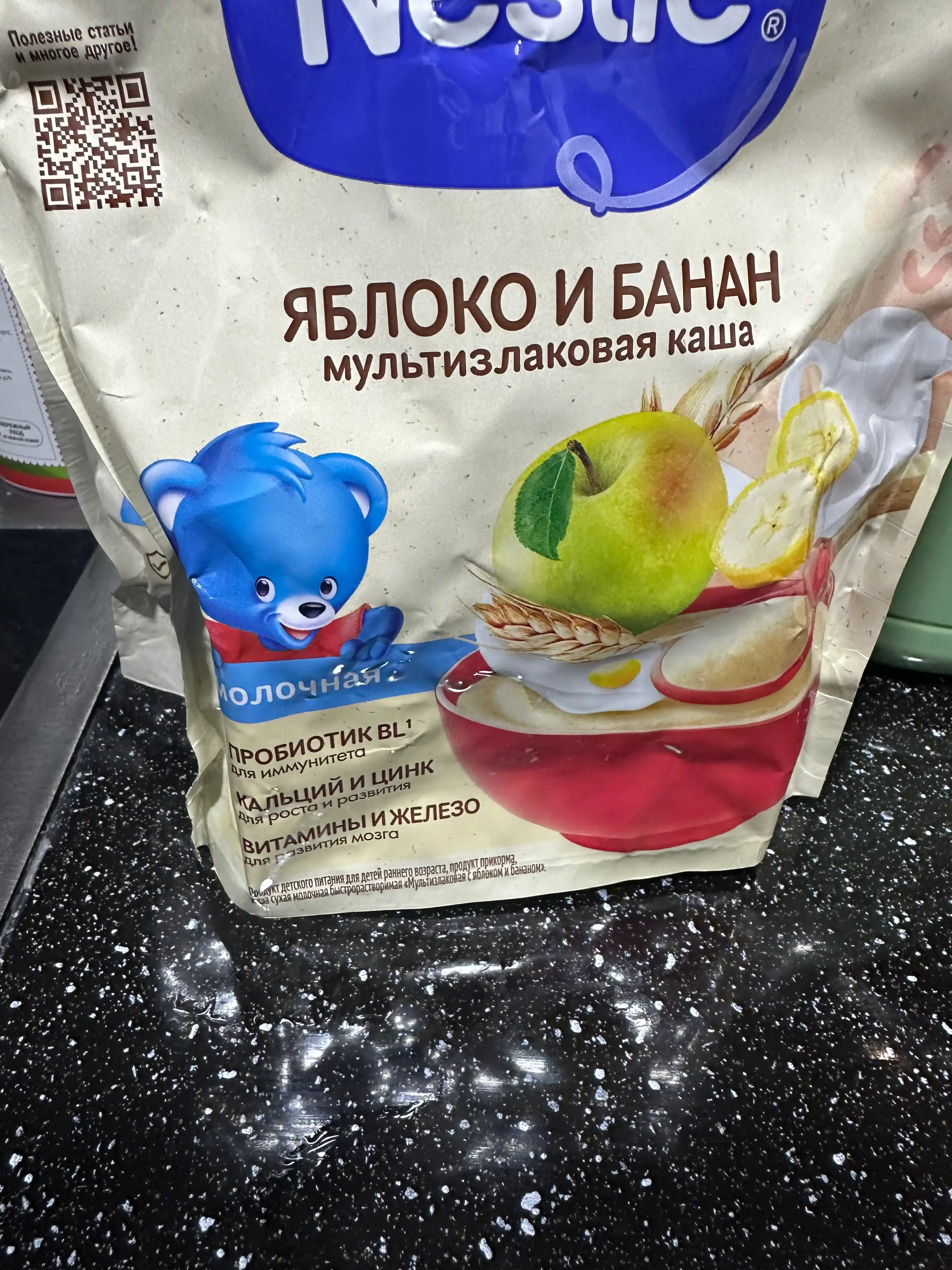 Nestle 6 oylik tez eriydigan "Olma-bananli multiflok" quruq sutli bo‘tqasi. 200g